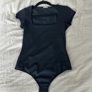 Free People Black Bodysuit with Sleek Design